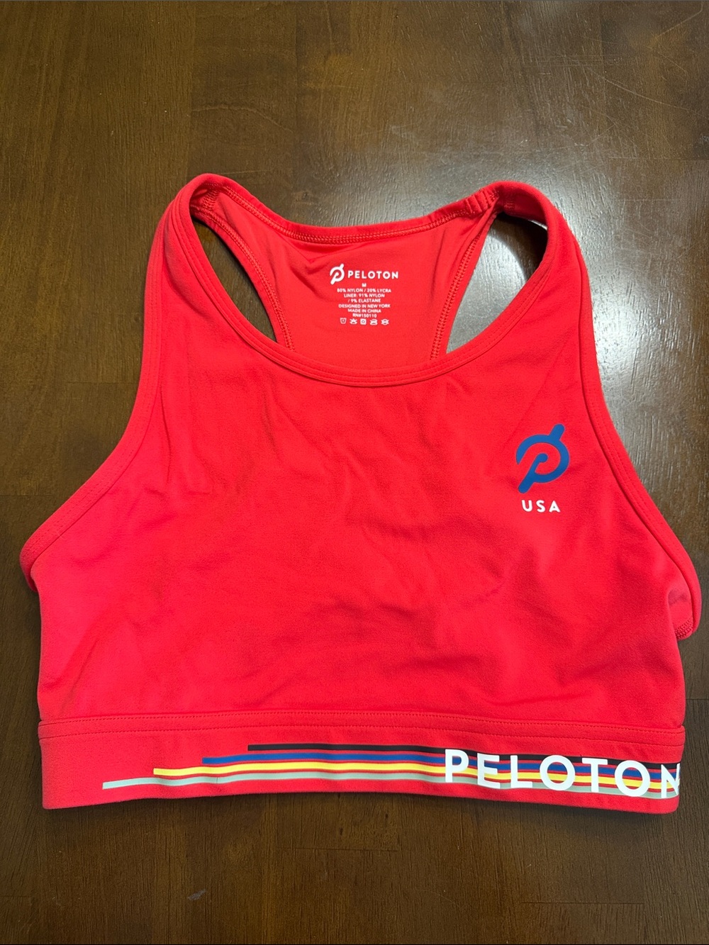 Peloton Red Racerback USA Sports Bra with Multicolor Band, medium
